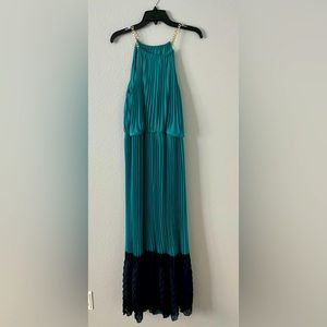 Pleated dress with chain straps.
